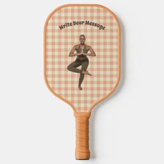 a wooden paddle with an image of a woman in yoga gear on it and the words, write your message