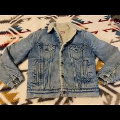 Vintage Levi’s Jacket Made Between Mid 1960s To 1971. Has Some Stains On The Front Shown In Picture And Some Around The Sleeves. Still In Good Condition Considering It’s 50 Or 55 Years Old. Retro Denim Jacket With Pockets For Winter, Retro Fitted Denim Jacket For Winter, Fitted Vintage Denim Jacket For Winter, Retro Medium Wash Winter Outerwear, Retro Medium Wash Outerwear For Winter, Vintage Denim Outerwear For Winter, Retro Winter Denim Jacket With Pockets, Vintage Blue Denim Jacket For Winter, Winter Retro Denim Jacket