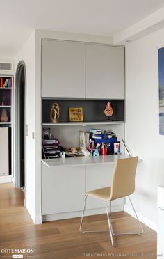 a white desk and chair in a room