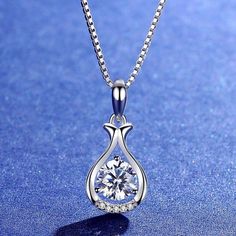 Solitaire: 1.00 carat VVS E/F  Gold: 14k 2.30 gm Small Diamonds: 0.10 carat VVS EF At SolitairesByMoha, you will get only the finest Lab Grown Diamonds that are well cut and are extra sparkly.  This solitaire is made by Chemical Vapour Deposition method. This Solitaire comes with IGI Certificate. Elegant Crystal Solitaire Necklace For Gift, Elegant Drop Necklace With Diamond Accents For Gift, Round Diamond Necklace With Elegant Design For Gift, Elegant Silver Solitaire Necklace With Flower Pendant, Round Diamond Necklace With Elegant Design, Elegant White Gold Drop Necklace Gift, Elegant White Gold Drop Necklace For Gift, Elegant White Gold Round Drop Necklace, Diamond Clavicle Chain Drop Necklace As Gift