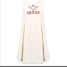 Stylish White Tennis Dress By The Famous Brand Gucci, She Will Look The Part In This White Tennis Dress With The Brand's Iconic Gucci Logo In Red On The Chest The Classic Tennis Paris Logo Is Neatly Embroidered With The Signature Rec Double Gg Logo At The Top. It Features A Simple Round Neckline, The Skirt Of This Girl Gucci White Dress Has Beautiful Pleats To The Front And Back Adding Volume There Is A Neatly Concealed Zip Fastening To The Back. Style It Dressed Up To Down. 100 % Authentic. White Fitted Gucci Dress, Designer White Sleeveless Dress, Nice Red Dress, White Tennis Dress, Tiger Girl, Gucci Dresses, Gucci Baby, Gucci Top, Red Sweater Dress