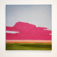 an abstract painting with pink and green colors on a white wall next to a blue sky