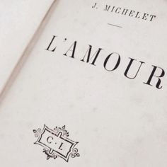 an open book with the word l'amour written on it