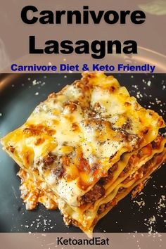 a black plate topped with lasagna covered in cheese