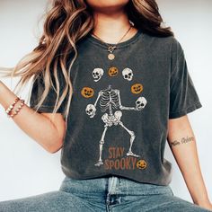 Embrace the spooky season with our Stay Spooky Shirt! This fun and comfy unisex Halloween Graphic Tee is perfect for casual spooky wear or completing your Halloween costume. With a stylish goth vibe, it keeps the spooky vibes alive all season. Celebrate in authentic, relaxed comfort. Stay spooky! About our T-shirt/Sweatshirts ⭐ 1. Comfort Colors T-Shirt Details: Made with 100% ring-spun U.S. cotton (6.1 oz/yd softened for comfort. Double-needle stitching for durability, seamless sides to maintai Spooky Skull Print Top For Fall, Spooky Skull Print Fall Top, Spooky Skull Print Tops For Fall, Spooky Halloween T-shirt With Graphic Print, Spooky Pre-shrunk T-shirt For Fall, Fall Skull Print Short Sleeve T-shirt, Skull Print Short Sleeve T-shirt For Fall, Short Sleeve T-shirt With Skull Print For Fall, Spooky Halloween Graphic Print T-shirt