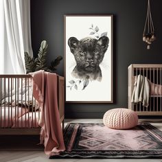 a baby's room with an animal print on the wall