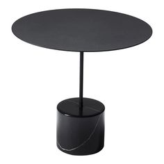 a round table with a black base and marble top