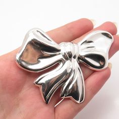 Great vintage condition. 925 Sterling Silver Vintage Mexico Bow Pin Brooch / Pendant Weight: 20.4g WELCOME TO PAWN SHOP We are an actual pawn shop and have been in business for over 25 years. Since 1990, our establishment has been serving a variety of clients by providing them with short term cash solutions and options of liquidity regarding their treasured heirlooms. Acknowledging that today′s customers are very sophisticated and are looking for a variety of investments, our acquisitions are ha Silver Costume Jewelry Brooch For Formal Occasions, Silver Costume Jewelry Brooches For Formal Occasions, Silver Costume Jewelry Brooches For Party, Formal Hallmarked Silver Brooches, Collectible Silver Costume Jewelry Brooch, Formal Silver Hallmarked Brooches, Formal Silver Hallmarked Brooch, Vintage White Gold Brooches For Gift, Hallmarked Silver Brooches For Gifts