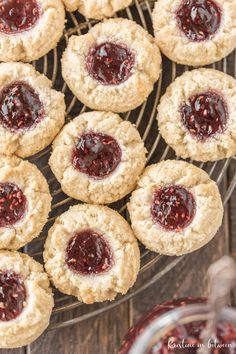 cookies with jam are on a cooling rack