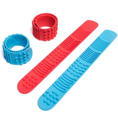 two plastic combs, one with holes and the other without teeth are shown on a white background