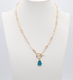 This Gold Blue Druzy Toggle Drop Necklace is an elegant and easy-to-wear accessory that will add a touch of glamour to any outfit. The gold-plated sterling silver chain is lightweight and comfortable to wear, and the blue druzy stone adds a touch of sparkle. The toggle clasp makes it easy to put on and take off, and the 18-inch length is flattering on most necklines. Casual Blue Necklace For Everyday Wear, Trendy Blue Chain Necklace Gift, Trendy Blue Chain Necklace For Gift, Blue Casual Jewelry With Adjustable Chain, Classic Gold-tone Toggle Necklace For Formal Occasions, Adjustable Blue Chain Necklace, Gold-tone Toggle Clasp Necklace For Formal Occasions, Gold-tone Metal Toggle Necklace With Chain, Gold-tone Toggle Necklace