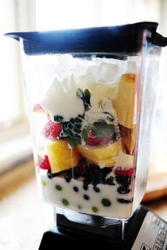 a blender filled with fruit and yogurt