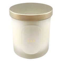 a white candle with a gold lid on a white background, that says kao