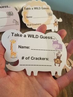 someone is holding up some wild guess cards