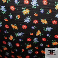 a black background with colorful flowers on it