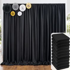 black and white backdrop with paper fan decorations