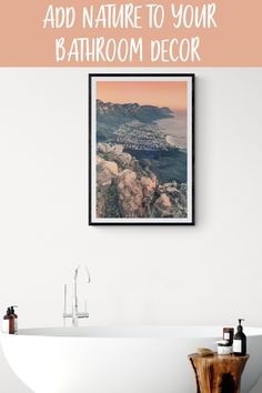 a bathroom with a bathtub, sink and framed photograph above it that says how to add nature to your bathroom decor