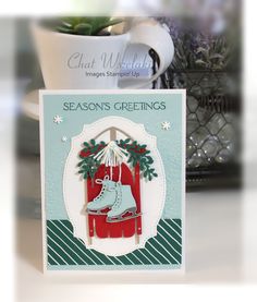 a christmas card with a pair of ice skates