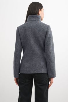 Handcrafted from 100% Italian virgin wool, our Essex offers pared-back contemporary styling in your new zip-up winter coat. Her off-center diagonal zipper fastens to create a high wrap neckline—structured enough to layer anything underneath comfortably (we've tested!). When worn open, by contrast, Essex offers artfully asymmetric lapels for additional visual interest. She's fully lined to keep you warm in cold temps and there are pockets to keep hands toasty, too.[SPLIT] Julia, in black and in m Winter Structured Wool Outerwear, Modern Funnel Neck Winter Outerwear, Modern Winter Outerwear With Funnel Neck, Modern Funnel Neck Outerwear For Fall, Fitted Funnel Neck Outerwear For Fall, Chic Funnel Neck Outerwear For Work, Winter Wool Turtleneck Outerwear, Wool Outerwear With Funnel Neck For Fall, Winter Workwear Outerwear With Asymmetrical Zip