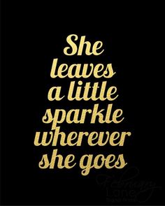 the words she leaves a little sparkle wherever she goes on a black background with gold foil