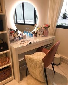 a white desk with a mirror on top of it and a chair in front of it