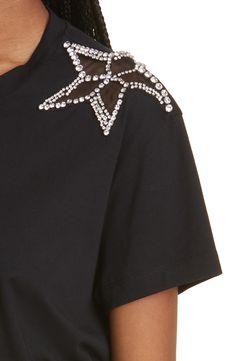 Sparkling stars adorn either shoulder of a cotton T-shirt that shows off this season's Y2K inspiration. 26" length (size Medium) Crewneck Short sleeves 100% cotton Dry clean Made in Portugal Women's Designer Clothing Black Y2k Fashion, Embellished Fitted Cotton T-shirt, Luxury Embellished Women's T-shirt, Fitted Black Embellished T-shirt, Cotton Short Sleeve T-shirt With Star Logo, Black Embellished Cotton T-shirt, Black Y2k, Black Shirts Women, Sparkling Stars