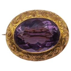 This striking amethyst brooch is an estate piece originating from the late nineteenth to early twentieth century. The setting is 14k yellow gold featuring a beautifully cut oval center stone. The stone is bezel set and the setting features a sculpted swirl pattern. This timeless piece would look lovely on a scarf or a lapel on anyone. Amethyst Brooch, Swirl Pattern, Bezel Setting, Timeless Pieces, Brooches, Swirl, Amethyst, Yellow Gold, Stone