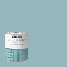 a blue paint can with the words, milk paint finish on it's side