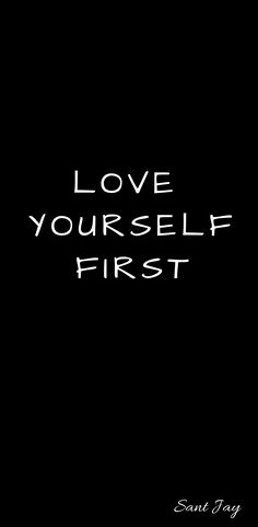 the words love yourself first are written in white ink on a black background with an image of