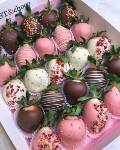 chocolate covered strawberries are in a pink box