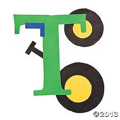 the letter t is made out of construction paper and has wheels on each one side