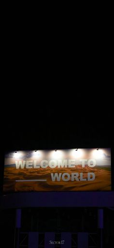 a large sign that reads welcome to the world