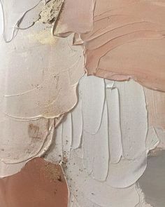 an abstract painting with different shades of pink and brown on the paint chipped wall