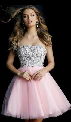 Be the delight of everyones eyes in Jovani 58470 fit and flare short party dress. The dress charms in a strapless straight across neckline and fully beaded fitted bodice. The delicately cinched natural waist leads the way to the short flirty A-line skirt with gauzy tulle fabric overlay and finishes at mid-thigh. Attract dazzling stares everywhere you turn in this beautifully festooned cocktail dress by Jovani. Model is wearing the Blush color. Bat Mitzvah Dresses, Flare Cocktail Dress, Jovani Gown, Fit And Flare Cocktail Dress, Strapless Dresses Short, Jovani Prom, Junior Prom, Strapless Cocktail Dress, A Line Cocktail Dress