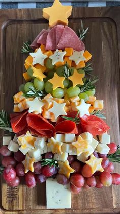 a christmas tree made out of cheese and grapes