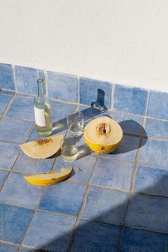 an apple and banana peel on a blue tiled counter