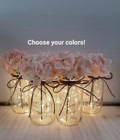 four mason jars with flowers in them and the words choose your colors