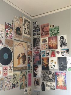 a wall covered in various posters and pictures