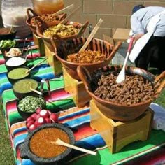 an outdoor buffet with many different foods on it