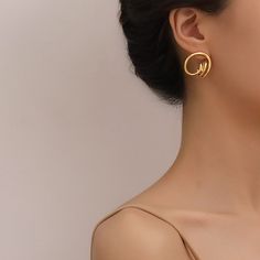 Our coating and high polish add secret ingredient to the rings for your contemporary & chic outfit. Abstract geometric earrings that will never go out of style, this jewelry piece is simple enough to accessorize easily but creative enough to make your look stand out. This pair of 18K gold statement earrings that compliments any outfit, easily create stylish look in Parisian, Minimalist, Bohemian, or even Punk. • S P E C I F I C A T I O N • Finish: 18K multi-layered gold plating on titanium steel Dimension: approx. 22 cm x 24mm For ring of this style please visit here. Minimalist Gold-plated Hoop Earrings, Minimalist Plated Metal Hoop Earrings, Minimalist Yellow Gold Plated Earrings, Minimalist Gold-plated Circle Earrings, Modern Drop Earrings With Plating, Minimalist Gold Plated Circle Earrings, Modern Gold Round Wrap Earrings, Modern Tarnish Resistant Wrap Earrings, Modern Plated Drop Earrings