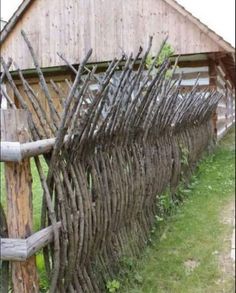 an old wooden fence made out of branches