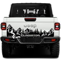 jeep gladiator decal on the back of a white truck with trees and mountains