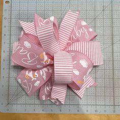 a close up of a ribbon on a cutting board