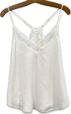 Delicate White Summer Camisole, White Delicate Camisole For Spring, Delicate White Camisole For Spring, White Camisole For Spring Layering, Delicate White Spring Camisole, White V-neck Top With Delicate Lace, Delicate White Sleeveless Top, Delicate White Summer Tops, Delicate White Tops For Summer