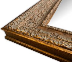 an ornate gold framed mirror on a white background