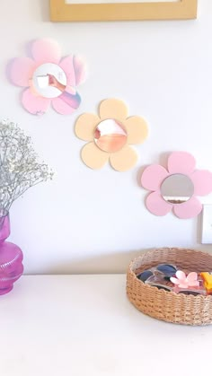 Three acrylic flower mirrors in pink, yellow & irirdescent colours above a hallway table as home decor. Pink vase with babies breath flowers and the bottom of a picture frame. There is a rattan basket with cute sunglasses and flower hairclips in it as well. Cite Mirrors, Cute Wall Mirrors For Bedroom, Aesthetic Flower Mirror, Flower Shaped Mirror, Witchcore Bedroom, Cute Mirrors, Pastel Mirror, Small Wall Mirror, Pink Bedroom Furniture