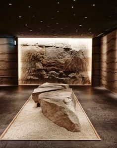 a large rock sitting in the middle of a room