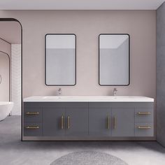 a bathroom with two sinks and mirrors on the wall