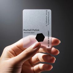 a person holding up a business card in their hand with the name rachel pollk on it