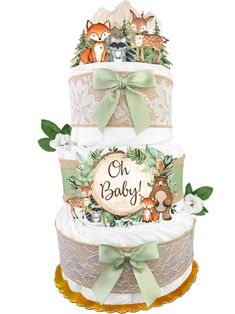 a three tiered cake with woodland animals on it